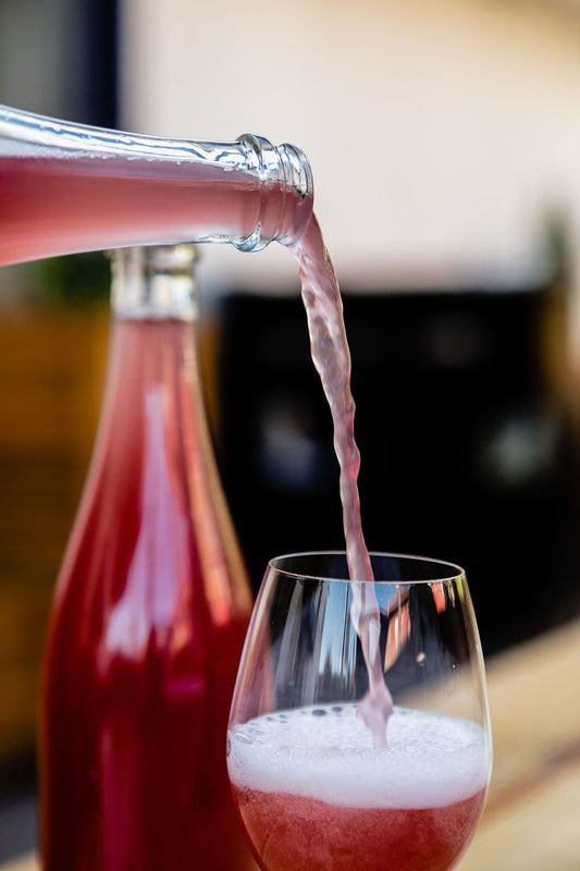 A grape ale gracing a glass